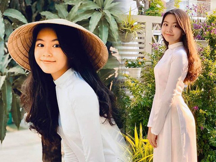 Thiếu nữ 14 tuổi mặc áo dài trắng trẻ trung đúng lứa tuổi.