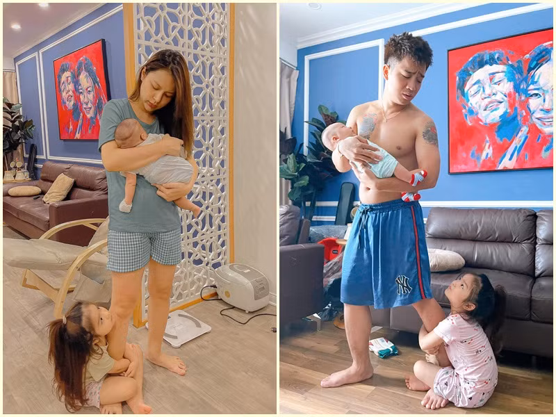 Bé Thóc rất nhí nhảnh. Cô nhóc ôm chân bố mẹ khi bố mẹ bồng em trai.