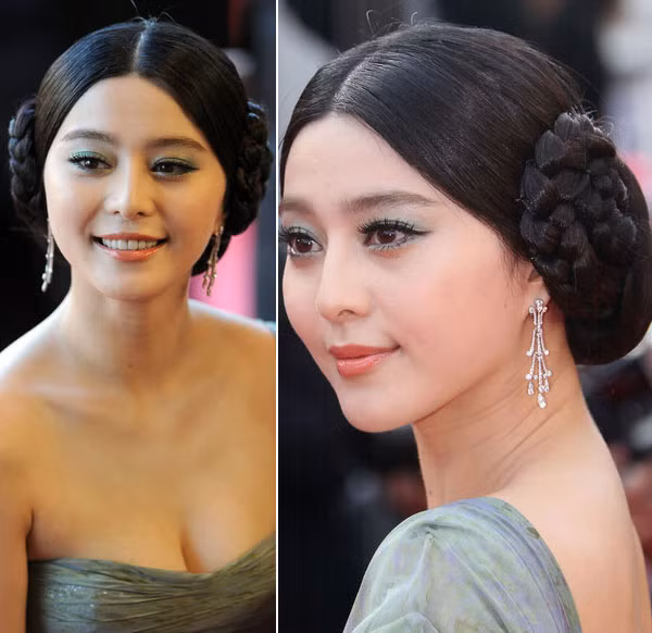 Việc sáng tạo kiểu tóc hai búi với phần tóc mái rẽ ngôi đã làm cho người đẹp bị già đi hàng chục tuổi.