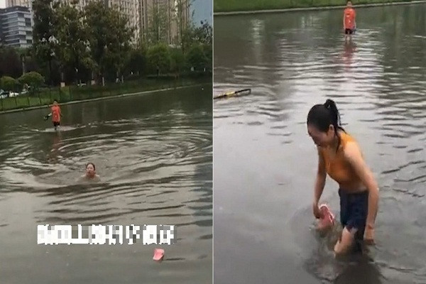 Video: Co gai boi qua con duong ngap nuoc vi so di lam muon