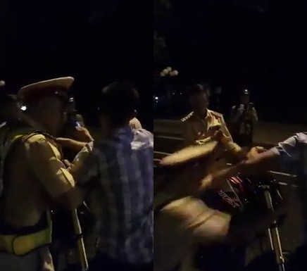 CSGT bat ngo nga xuong duong sau khi cham tay mot thanh nien