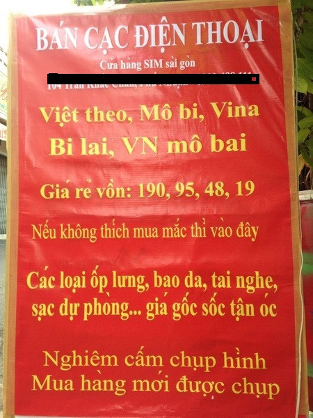 Biển cảnh báo khách chỉ được chụp hình khi đã mua card điện thoại "Việt theo, Bi lai, Mô bi"....