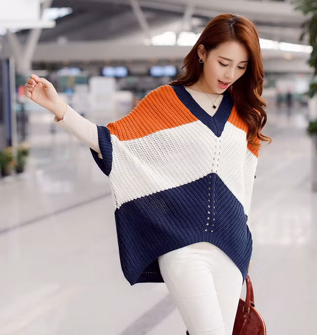 Mặc áo len dáng rộng cùng các kiểu quần tây sang trọng cũng là set đồ giúp các nàng công sở thể hiện nét cá tính khi đến văn phòng.