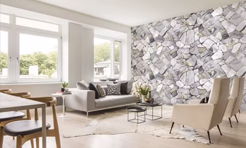 Giấy dán tường 3D giả vân đá giúp phòng khách mang đậm hơi thở thiên nhiên. Ảnh: Giaydantuongnnd.
