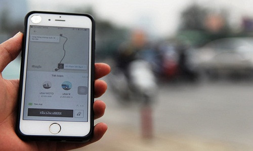 Grab cho rằng không có trách nhiệm với khoản nợ thuế của Uber tại Việt Nam sau khi sáp nhập. Ảnh: HC.