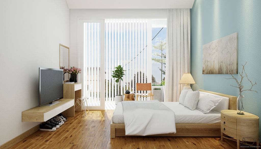 Một phòng ngủ thoáng sáng bố trí ở tầng lửng.