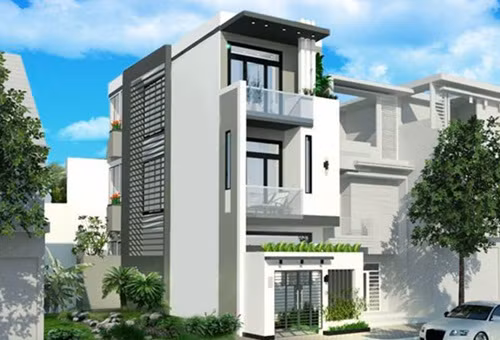 Mẫu nhà phố 3 tầng sử dụng gam màu trắng chủ đạo mang đến vẻ đẹp thân thiện, tươi mới. Cổng sắt thiết kế thoáng, bên trên có ô vuông đất trồng cây cảnh. Ảnh: Arcviet.