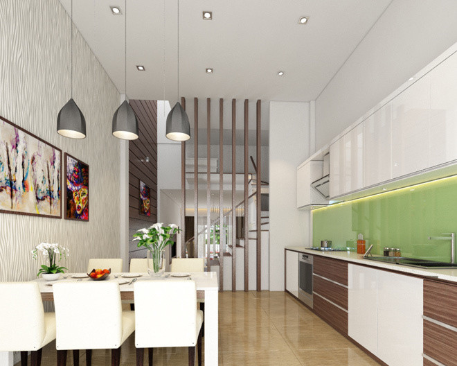 Dù diện tích chật hẹp nhưng nhờ màu trắng chủ đạo, điểm thêm tranh treo tường và đèn trần trang trí, không gian phòng bếp vẫn rộng rãi và thoáng đãng hơn.