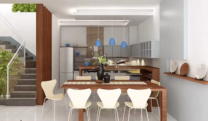 Tủ bếp và bàn ăn được xếp theo chiều ngang nhưng không hề khiến căn bếp chật chội.