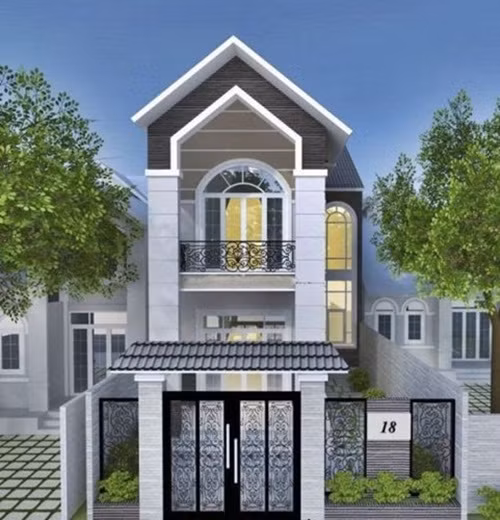 Nhà phố mái thái nổi bật với họa tiết ở lan can sắt và cổng ra vào. Ảnh: Nhabinhduong.