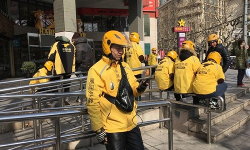 Wang Junqiang hài lòng với việc tiếp tục lao động trong kỳ nghỉ dài. Ảnh: Mandy Zuo.