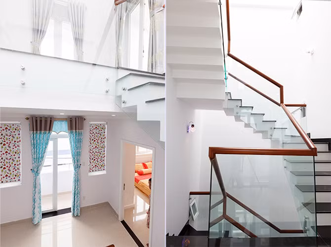 Cầu thang gỗ lan can kính vừa giúp không gian rộng thoáng không ngờ vừa tăng tính thẩm mỹ cho ngôi nhà.