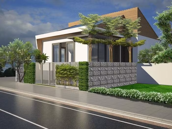 Căn nhà thiết kế nhỏ gọn, thoáng mát với nhiều cây xanh bên ngoài. Ảnh: Tiền Phong.