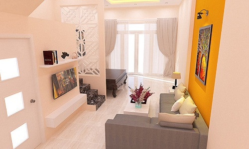 Phòng khách với các đồ nội thất hiện đại. Gam màu trung tính gợi cảm giác thoáng rộng cho cả không gian tầng 1.