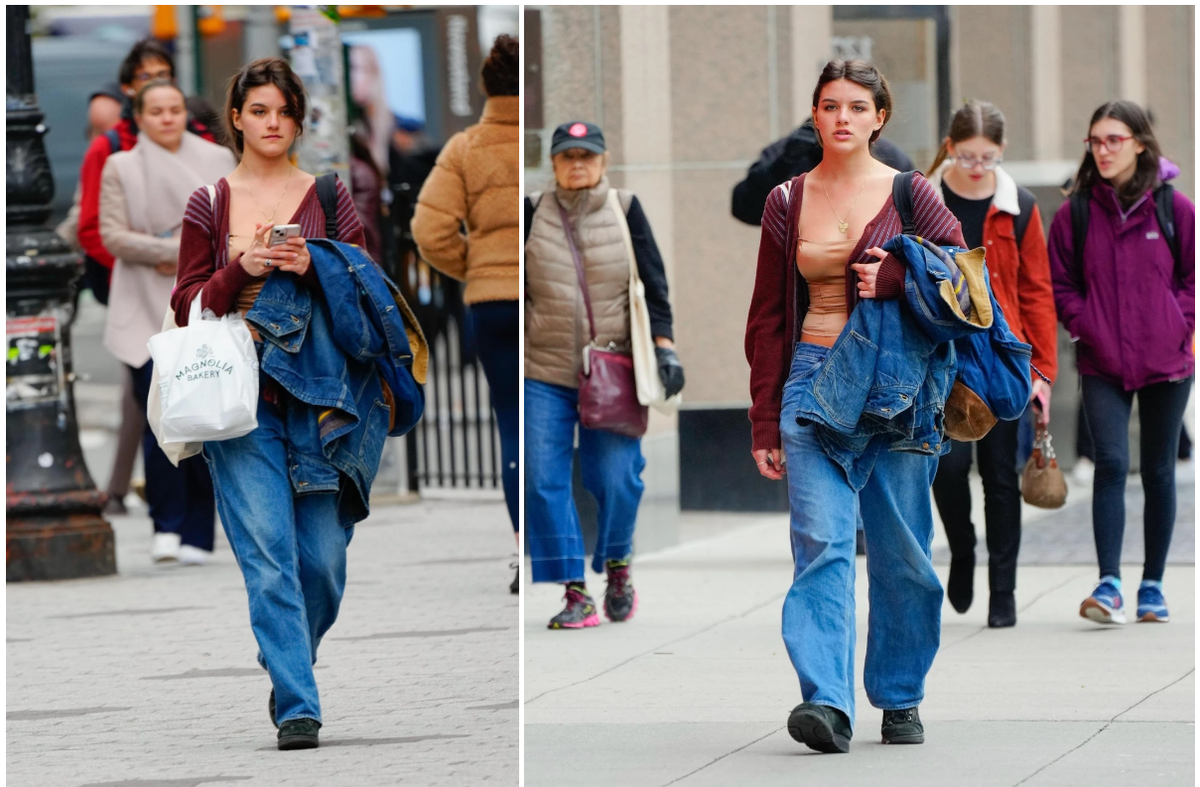 Gu thời trang của Holmes chịu ảnh hưởng bởi thành phố New York - nơi dễ dàng nhìn thấy những phụ nữ ăn diện đơn giản, thoải mái, thích giày sneakers và quần jeans rộng thùng thình. Suri nhiều lần được bắt gặp với hình ảnh tương tự, song có cách phối trẻ trung, hợp tuổi. Ảnh: TheImageDirect.