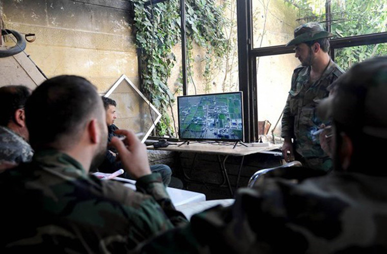 Nguồn tin cho hay, Quân chính phủ Syria và đồng minh đã bắt đầu tiến vào quận Ayn Tarma và tái chiếm một căn cứ chính của phiến quân Faylaq al-Rahman. Ảnh: FNA.