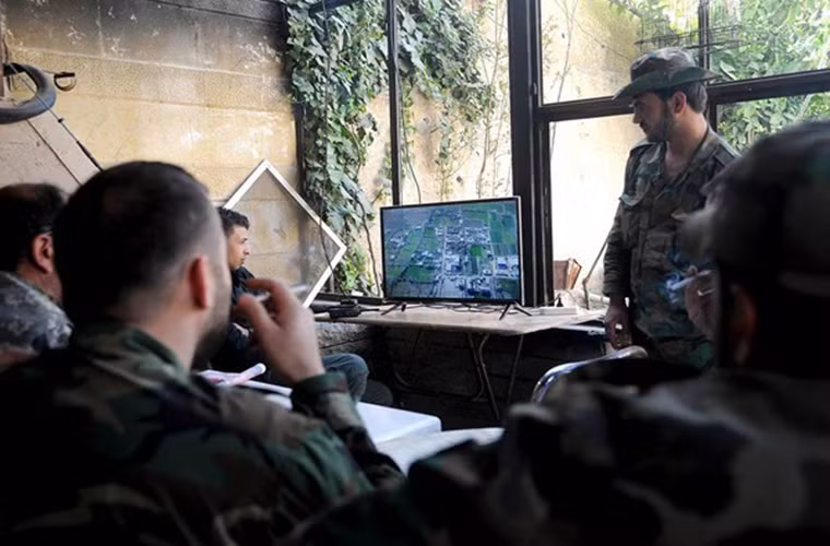 Nguồn tin cho hay, Quân chính phủ Syria và đồng minh đã bắt đầu tiến vào quận Ayn Tarma và tái chiếm một căn cứ chính của phiến quân Faylaq al-Rahman. Ảnh: FNA.