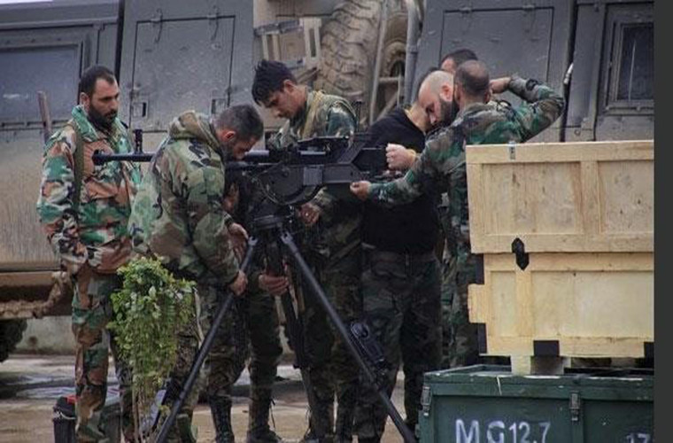 Trong khi đó, Quân đội Syria đã điều động lượng lớn binh sĩ và trang thiết bị quân sự tới khu vực phía nam Damascus để chiến đấu với phiến quân IS. Ảnh: FNA.