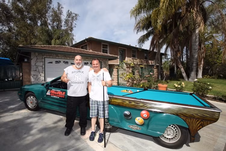 Joe Fiscella là chủ của cửa hàng Triangle Billiards and Bar Stools, nơi bán nhiều dạng bàn bi-a và phụ kiện khác nhau. Hồi năm 2011, trong một lần nói chuyện với bạn về việc tham gia vào một sự kiện chơi bi-a vì mục đích từ thiện, anh ấy nói đùa rằng sẽ nghĩ ra cách để đưa bộ môn thể thao này lên đường phố. Sau đó, Fiscella nảy ra ý tưởng một chiếc xe ôtô kiêm bàn bi-a mà vừa có thể phục vụ mục đích quảng cáo kinh doanh, vừa cung cấp cơ hội vui chơi cho mọi người.