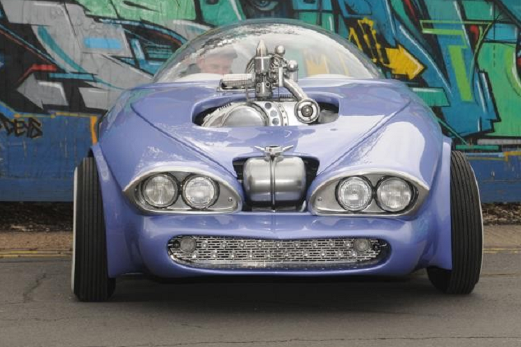 Phong cách của Cosmo được lấy cảm hứng một phần từ tác phẩm của họa sĩ Ed Roth và những chiếc xe ô tô tương lai của những năm 1960. Paul từng chia sẻ trong video phỏng vấn rằng anh ấy nhớ hồi nhỏ được nghe kể là mọi chiếc xe trông sẽ như thế này vào năm 2000. Thất vọng khi thấy sự thực không như mong đợi, anh ấy quyết tâm biến giấc mơ thuở nhỏ thành hiện thực.