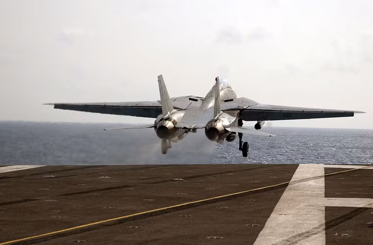 Đầu năm 1975, tàu sân bay USS Enterprise (CVN-65) mang theo liên đội hàng không với hai phi đội tiêm kích F-14A (VF-1 và VF-2) hành quân tới vùng biển Việt Nam tham gia "chiến dịch Gió lốc" di tản toàn bộ công dân Mỹ khỏi Sài Gòn vào tháng 4/1975. Trong suốt thời gian diễn ra chiến dịch này, các máy bay F-14 đã tiến hành hoạt động suốt tuyến đường bay của trực thăng di tản người Mỹ. Đây chính là sứ mệnh đầu tiên của F-14 và cũng là cuối cùng của mẫu máy bay chiến đấu tối tân này ở Việt Nam.