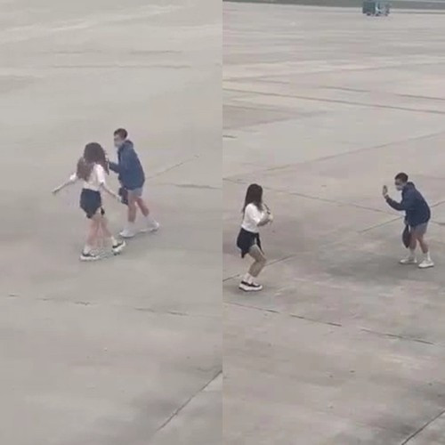 Hai bạn trẻ thản nhiên quay clip tại sân đỗ máy bay.