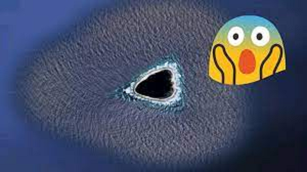 Nhiều giả thuyết khác lại tập trung vào độ sẫm màu của khu vực này. Tài khoản The_Professor64 nhận xét: "Có thể một núi lửa dưới lòng đất đã khiến hòn đảo có màu đen, nếu đây không phải là hố đen. Gần giống như đá hỏa sinh".