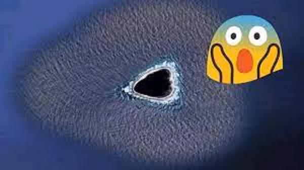 Nhiều giả thuyết khác lại tập trung vào độ sẫm màu của khu vực này. Tài khoản The_Professor64 nhận xét: "Có thể một núi lửa dưới lòng đất đã khiến hòn đảo có màu đen, nếu đây không phải là hố đen. Gần giống như đá hỏa sinh".