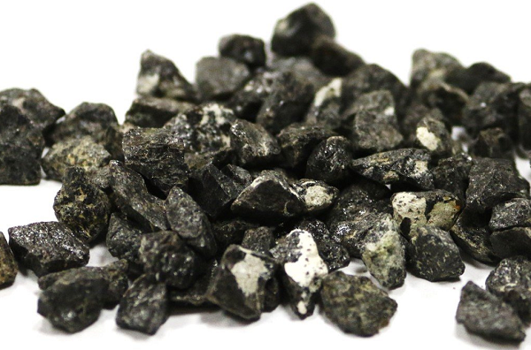 Sau đó, các tinh thể Corundum chứa Carmeltazite được vận chuyển qua các lỗ thông núi lửa vào lớp vỏ trên của Trái Đất. 65 triệu năm trước núi lửa đã phun trào dung nham và luồng hơi nước tràn ngập lớp vỏ trên, tạo ra các lớp trầm tích dày của dăm kết núi lửa và tuff.