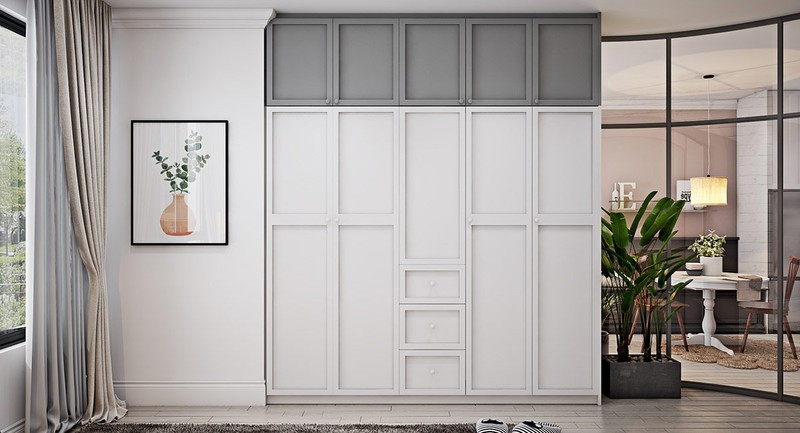 Để giải quyết vấn đề lưu trữ cho căn hộ, một chiếc tủ âm tường đã được thiết kế và đặt cạnh phòng ngủ.