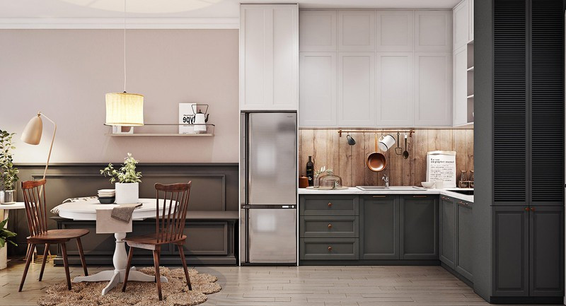 Cuối căn phòng là một nhà bếp hình chữ L gọn gàng, để chủ nhân căn hộ có thể trổ tài nấu nướng.