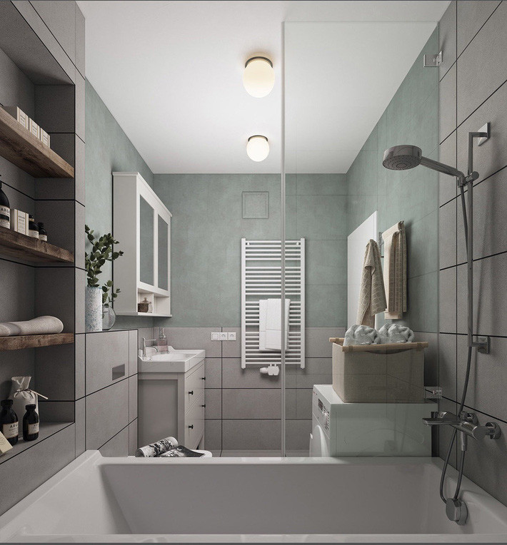 Phòng tắm cỏ tủ lưu trữ màu trắng, hài hòa với sắc xanh bàng bạc của tường. Một tông màu teal nhẹ và khăn mang lại một nét nữ tính cho một không gian phòng tắm dịu êm.