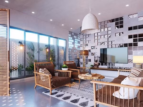 Sàn bê tông cùng nội thất tre gỗ với những hoa văn độc đáo khiến ngôi nhà ấm cúng và sang trọng.