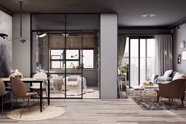 Bàn ăn đồng thời cũng là bàn làm việc, đặt ngay ngắn ngăn giữa phòng khách với phòng ngủ.