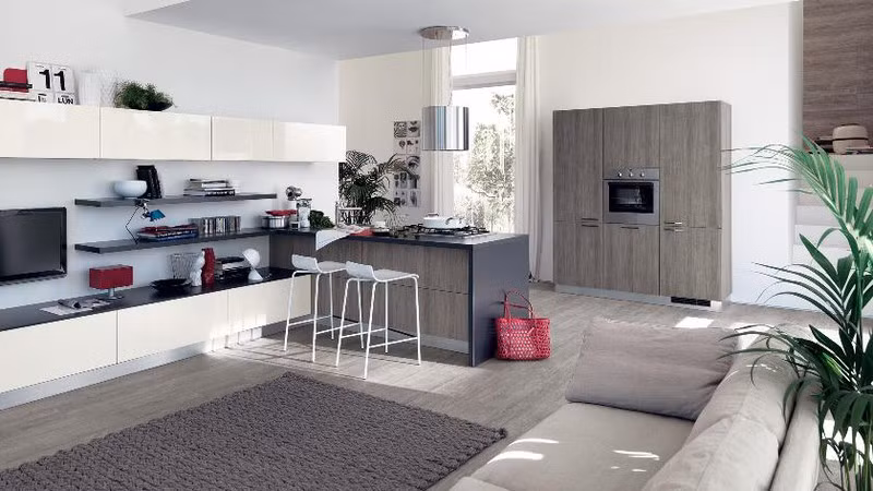 Tủ tivi kéo dài đến tận bếp tăng diện tích lưu trữ.