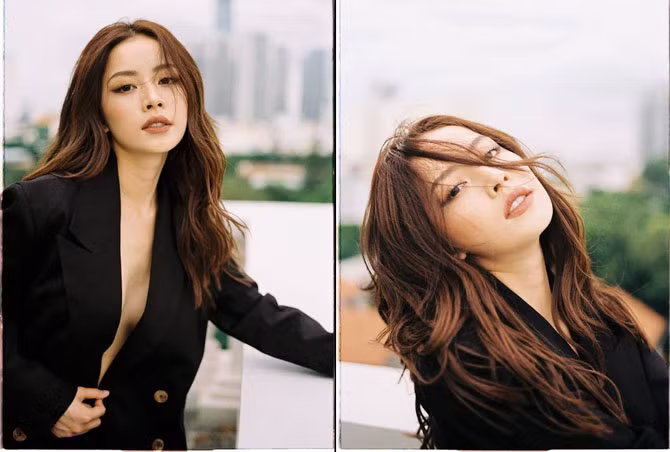 Cô nàng ngày càng táo bạo khi để lộ vòng 1 lấp ló sau lớp áo vest hở cúc hờ hững.