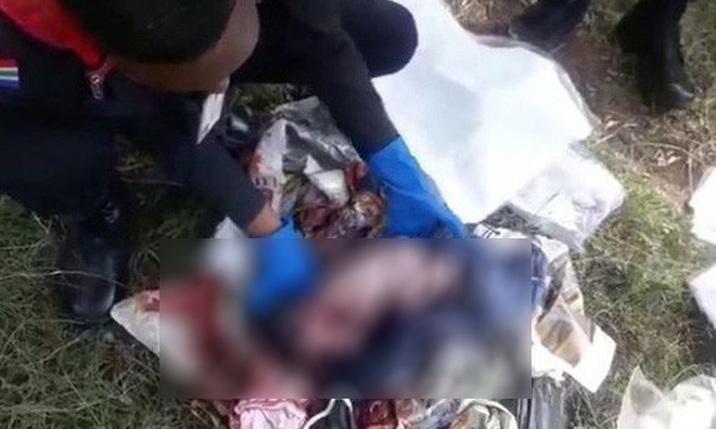 Hai hung phat hien em be so sinh trong dong rac