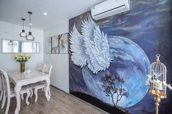 Điểm nhấn của của phòng khách chính là bức tranh vẽ lên tường.