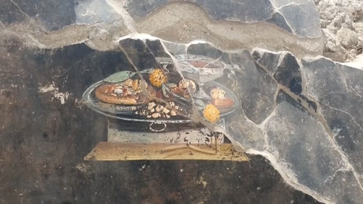 Phát hiện này thách thức quan niệm trước đây rằng pizza là thức ăn nhanh hiện đại, cho thấy nguồn gốc cổ xưa hơn của món ăn này. (Ảnh: DW)