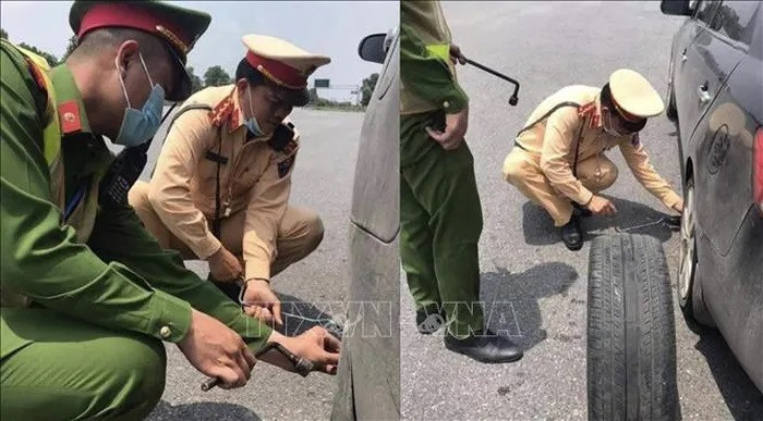 CSGT giup mua xang, thay lop o to cho nguoi dan tren cao toc Noi Bai – Lao Cai