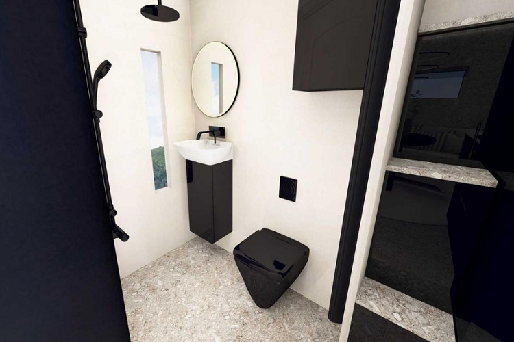 Bước ra khỏi phòng tắm, bạn sẽ thấy phòng ngủ chính với giường cố định ở hốc tường phía trên cabin. Một phần nóc có thể bật lên trên hốc tường sẽ giúp người nằm ngủ có thêm chút không gian. 