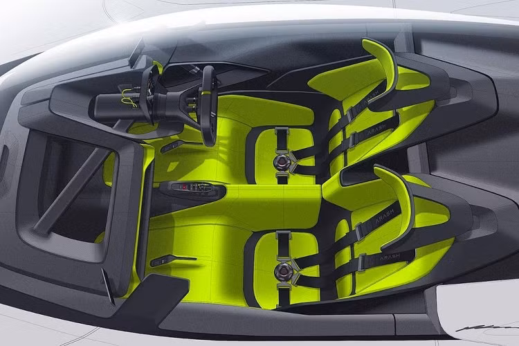 Chúng ta cũng có được cái nhìn cơ bản vào bên trong nội thất, nơi có chỗ cho 2 người ngồi trên ghế kiểu xe đua kèm dây đai an toàn tương ứng. Ngoài ra, cabin còn có hai màn hình nhỏ gắn ở hai bên thay cho gương chiếu hậu truyền thống.