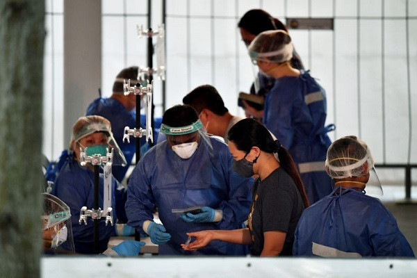 Ca mac moi Covid-19 gia tang, Singapore tam ngung ke hoach mo cua