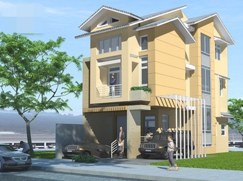 Nhà 3 tầng mái kép nổi bật với màu sơn vàng nhạt chủ đạo, có gara để xe rộng rãi. Ảnh: Dulux.