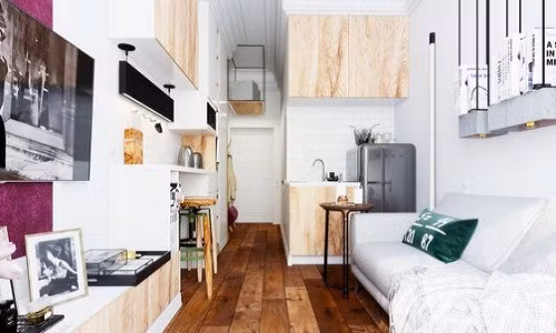 Cạnh sofa là khu vực bếp với các đồ dùng cần thiết bếp nấu nhỏ, bồn rửa và chiếc tủ lạnh mini.