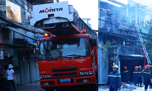 Xe thang chuyên dụng cũng được điều động tham gia chữa cháy căn nhà cao tầng.