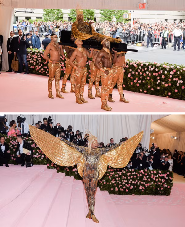 “Chơi lớn” hơn cả là vẻ ngoài của Billy Porter tại Met Gala 2019. Thay vì phô diễn hàng hiệu, ngôi sao thể hiện trang phục của mình như một tác phẩm nghệ thuật. Anh chuẩn bị tới 6 người khiêng mình ra sân khấu. Đôi cánh dài cùng phụ kiện bằng vàng thật khiến Vogue được đánh giá là người có diện mạo tuyệt vời nhất trong lịch sử Met Gala.