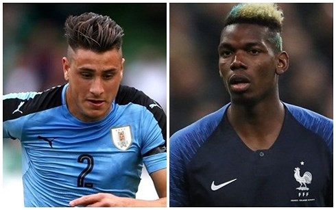 Pogba (Pháp) vs trung vệ Gimenez của ĐT Uruguay (Ảnh: Getty).