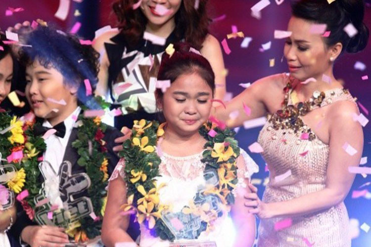 Sở hữu giọng hát ngọt ngào tình cảm, Thiện Nhân đăng quang quán quân Giọng hát Việt nhí 2014. Ảnh: Vietnamplus