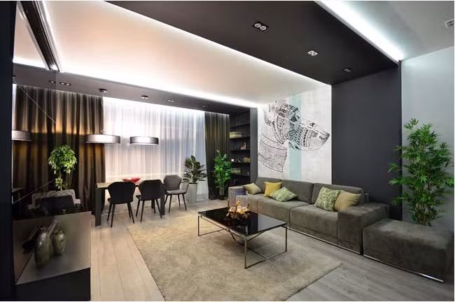 Một mẫu phòng khách có cây xanh sử dụng tông màu trầm tạo sự sang trọng, tinh tế. Ảnh: Noithattrevietnam. 